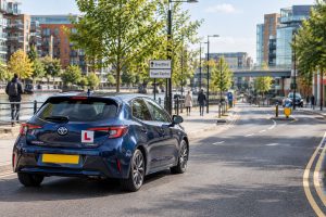 Driving lessons Brentford with learner driver and professional instructor on a West London road